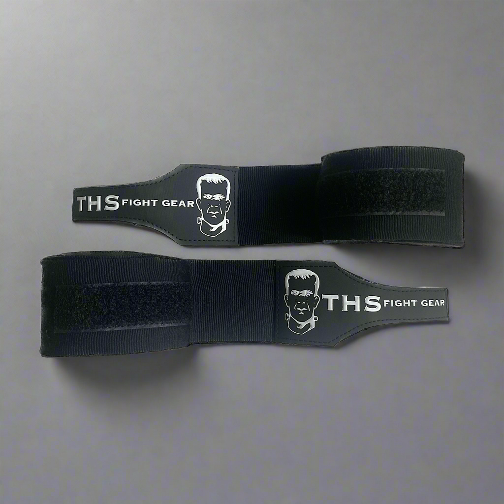 THS Fight Gear black hand wraps two wraps half rolled front view display