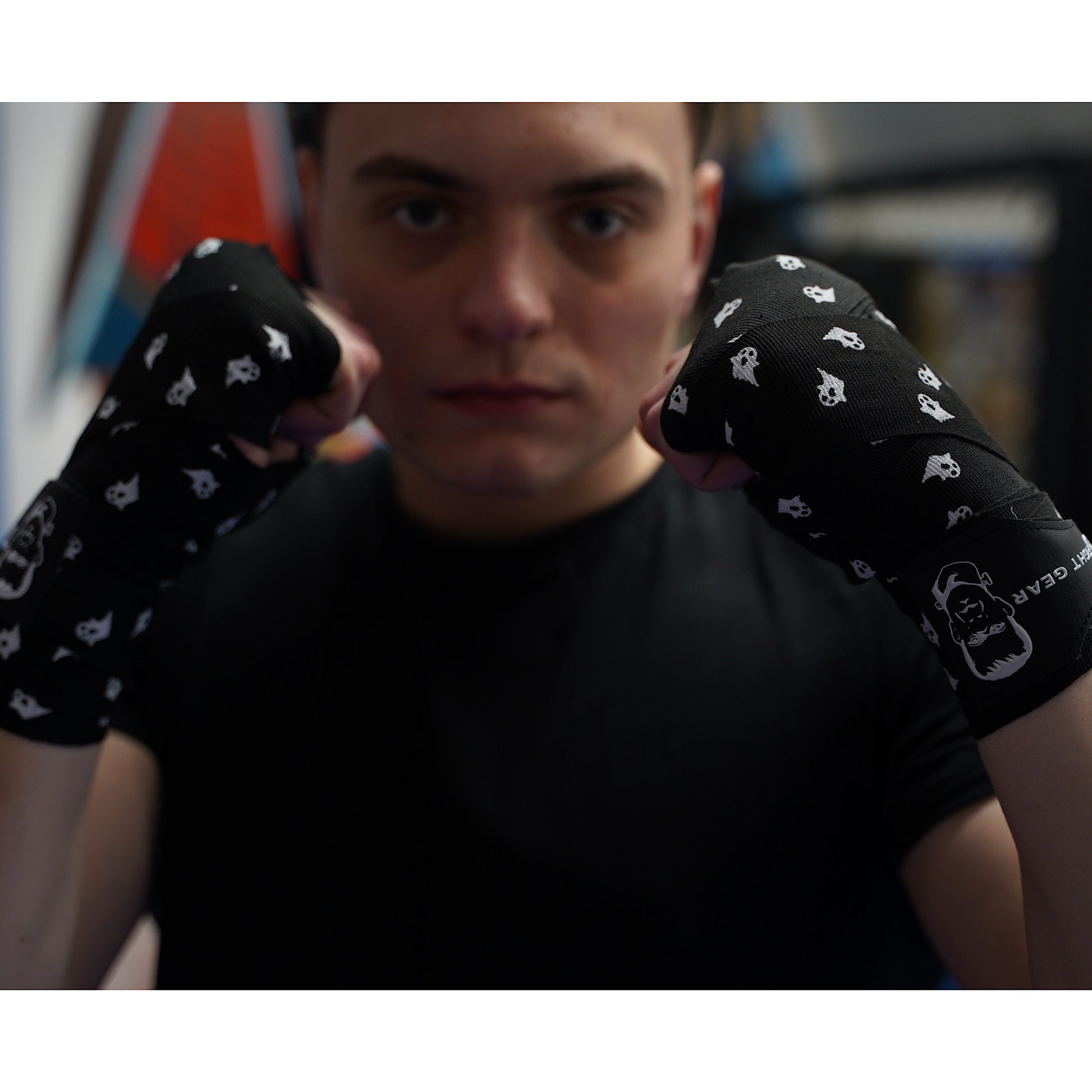 THS Fight Gear black with ghosts hand wraps hands wrapped fighter stance front view modelled