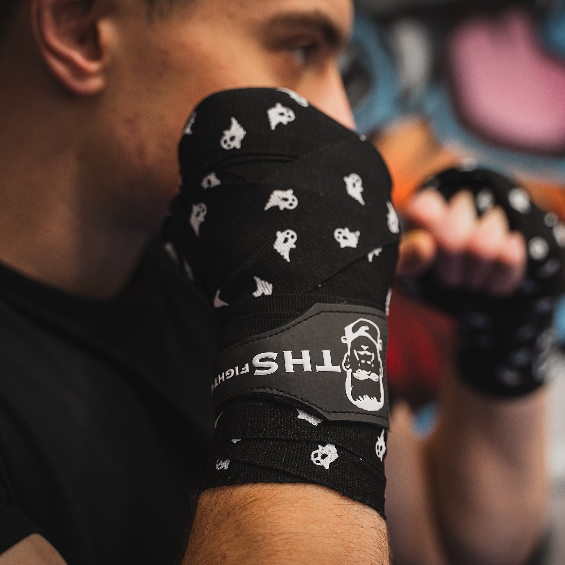 THS Fight Gear black with ghosts hand wraps hands wrapped fighter stance right view modelled