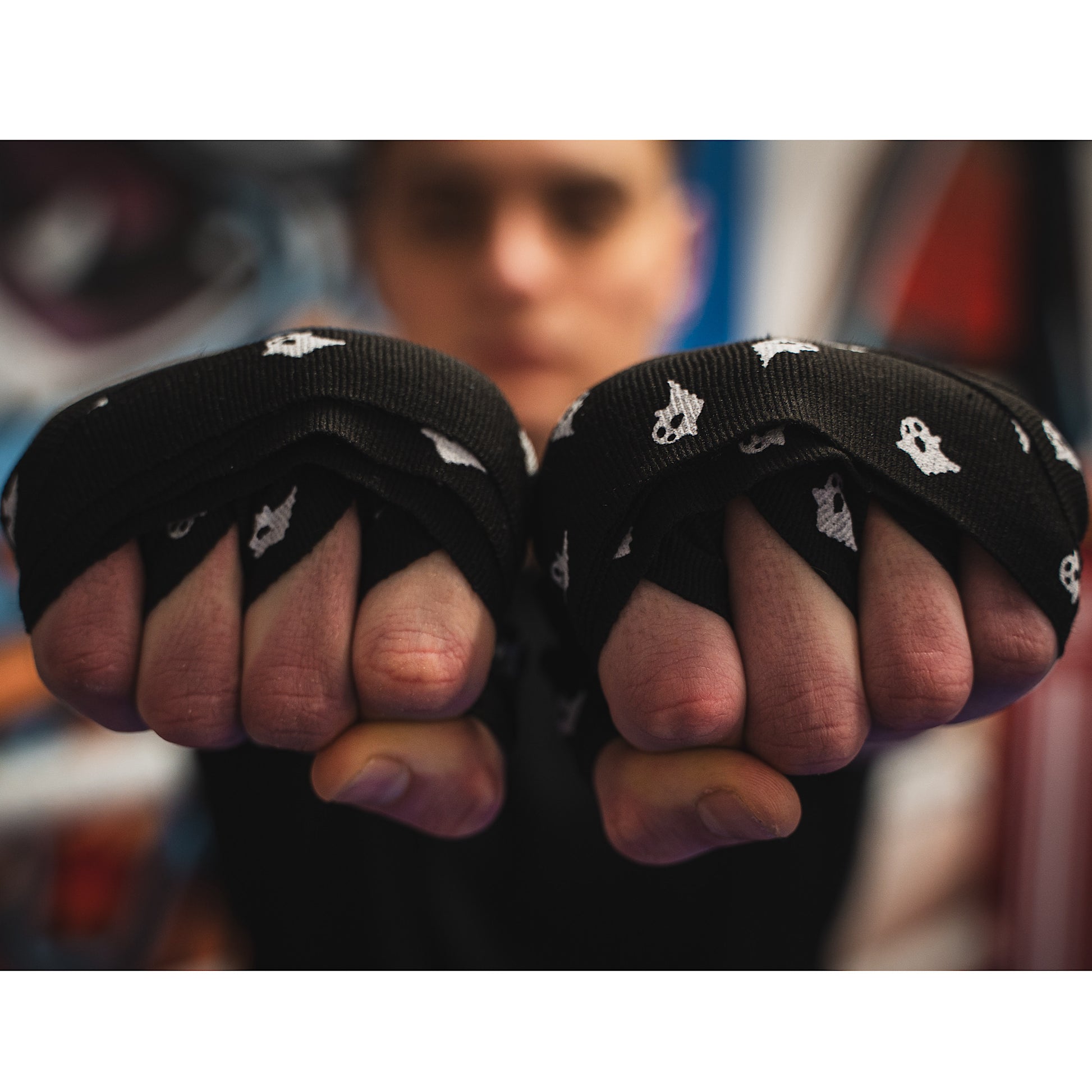 THS Fight Gear black with ghosts hand wraps hands wrapped tight fists front view modelled