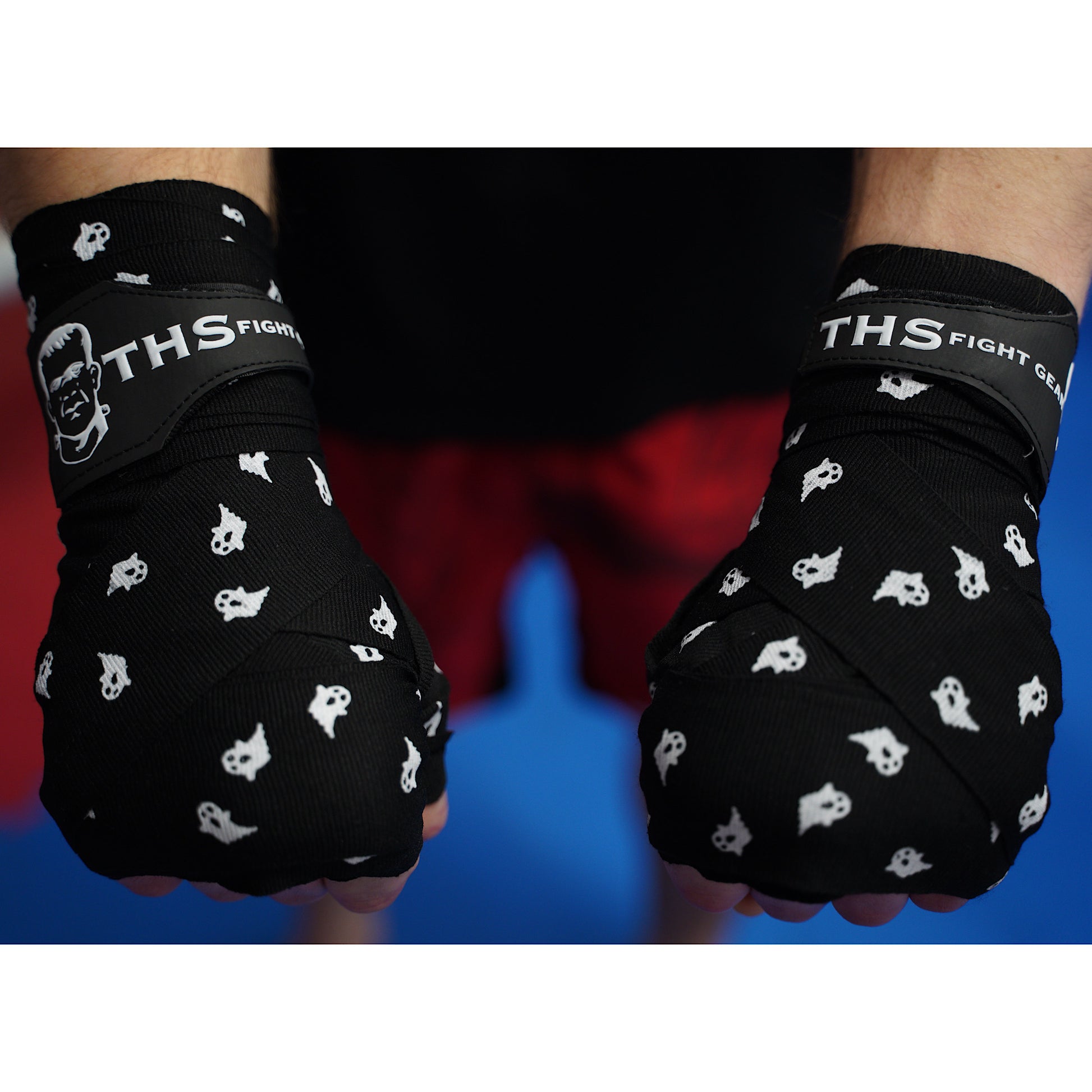 THS Fight Gear black with ghosts hand wraps hands wrapped tight fists over view modelled