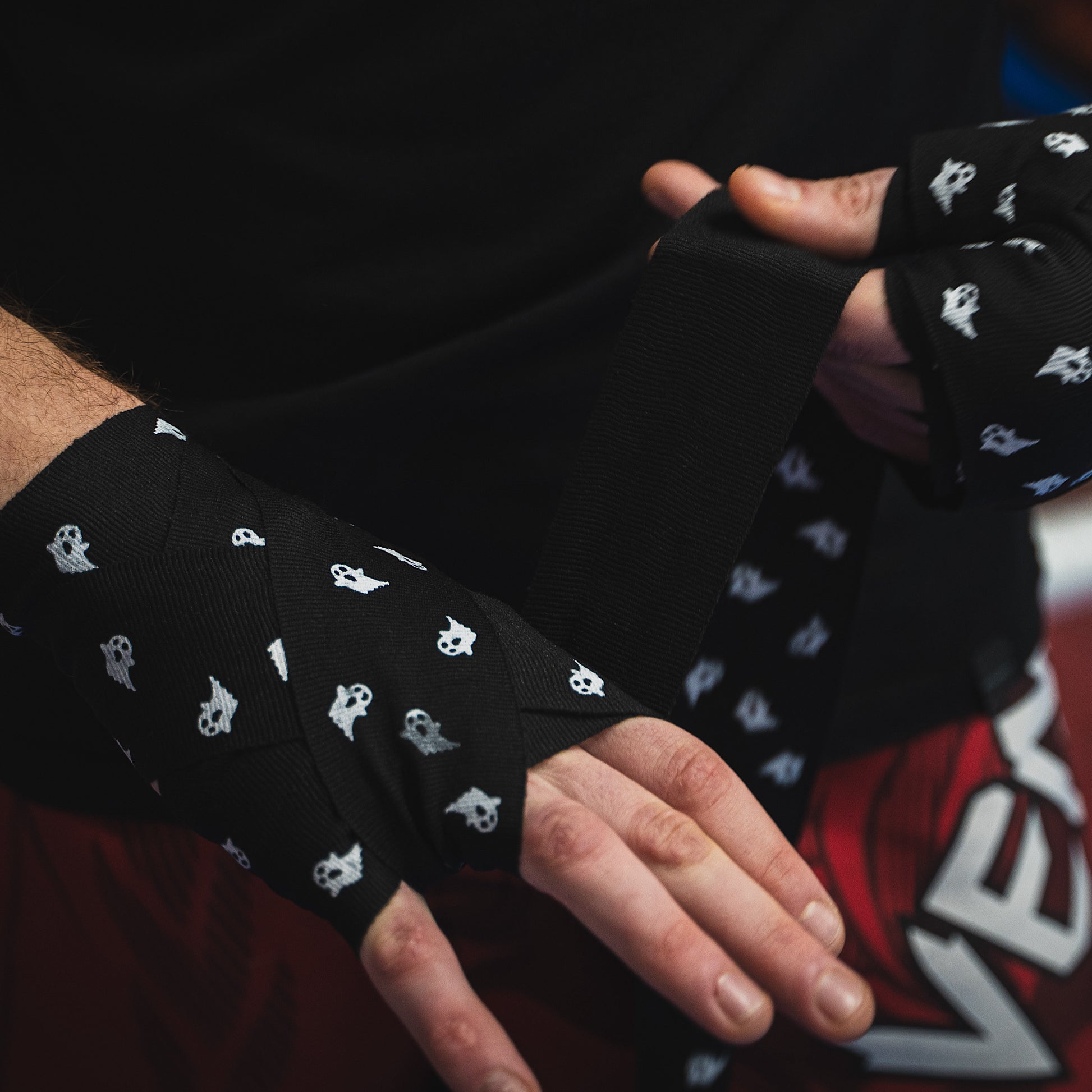 THS Fight Gear black with ghosts hand wraps wrapping hands front right view modelled