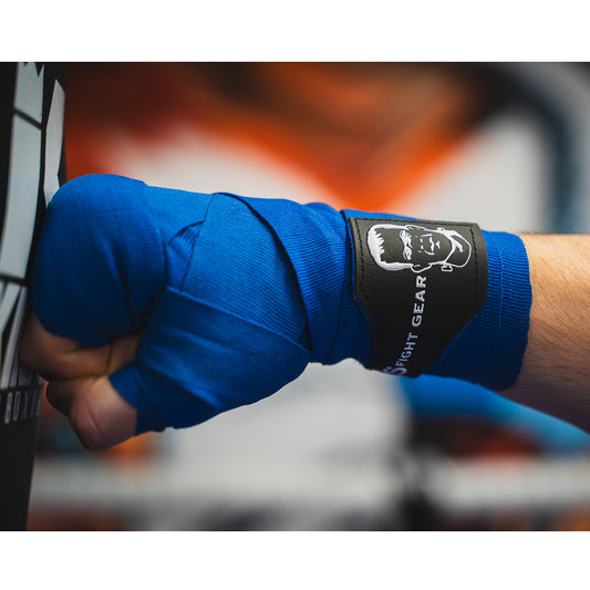 THS Fight Gear blue hand wraps punching hand pad close up modelled