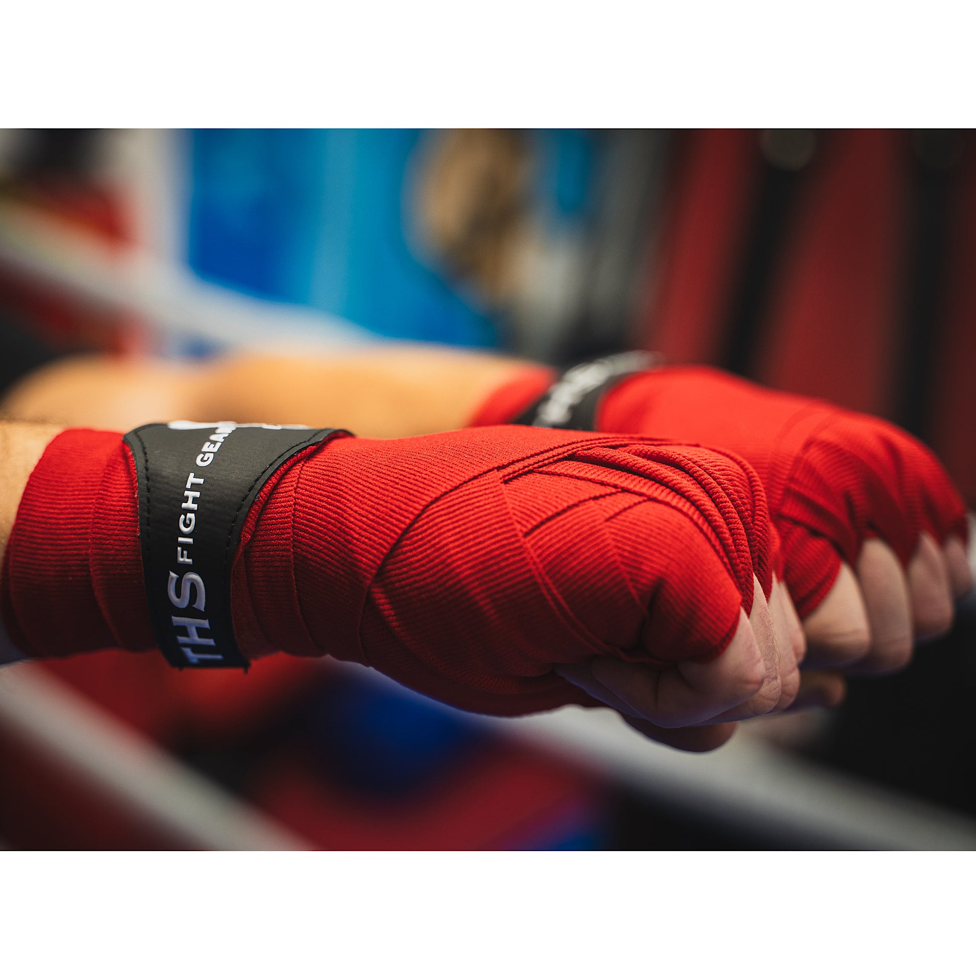 THS Fight Gear red hand wraps wrapped hands fists front right view modelled