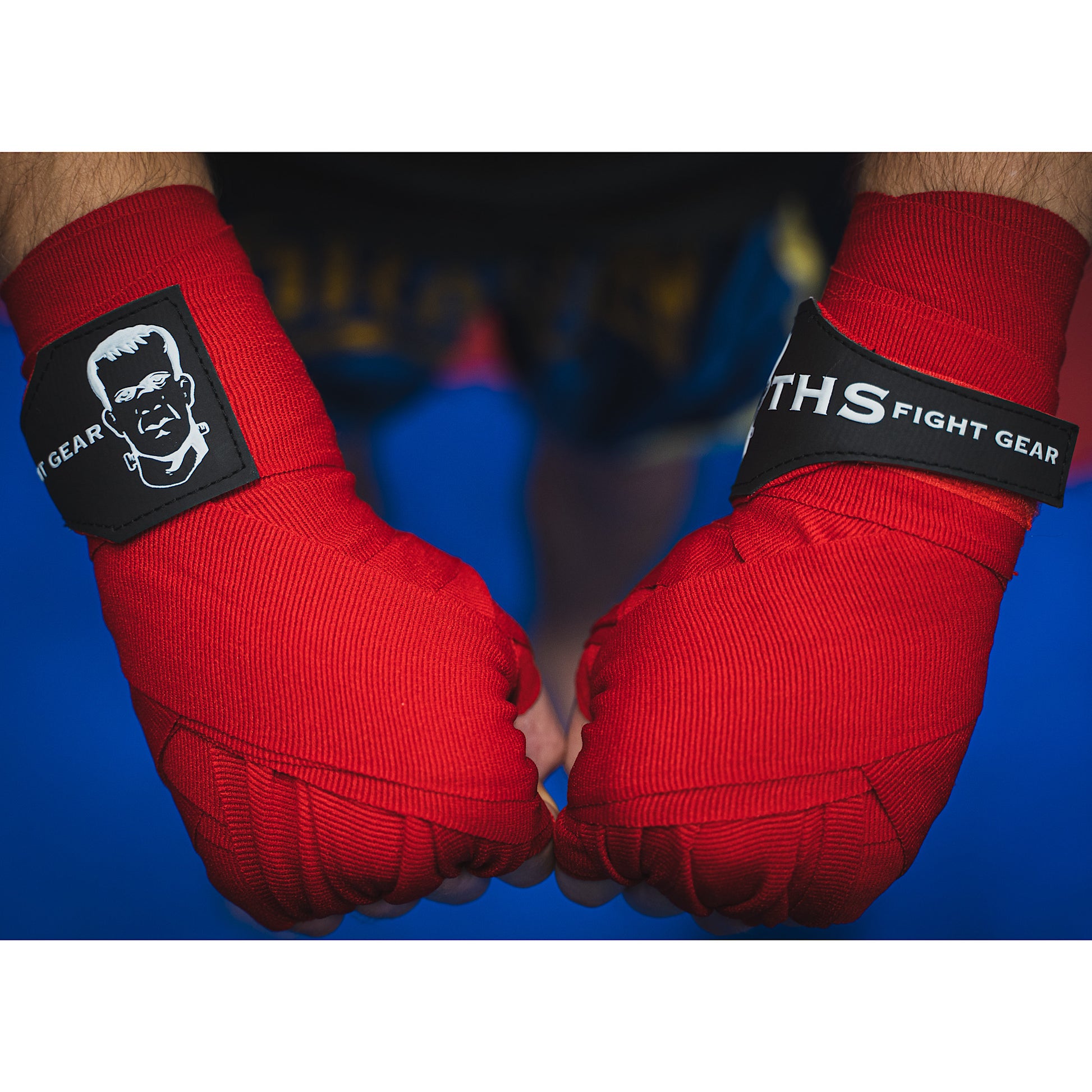 THS Fight Gear red hand wraps wrapped hands fists over view modelled