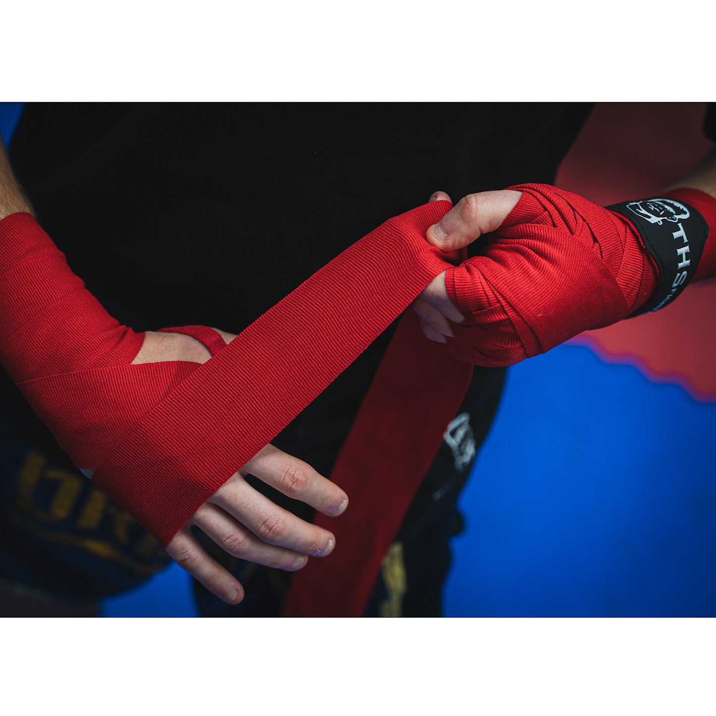THS Fight Gear red hand wraps wrapping hands front right view modelled