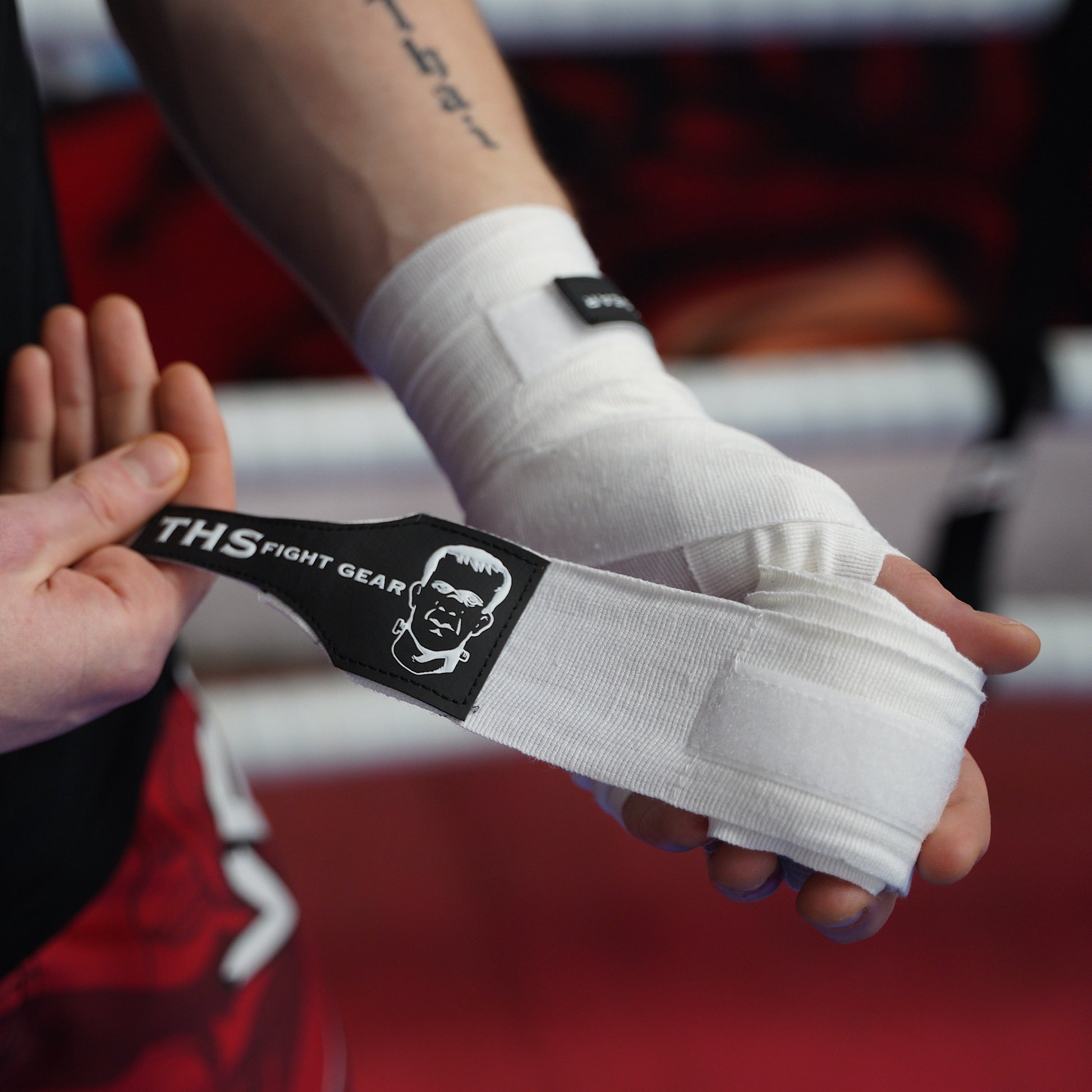 THS Fight Gear white hand wraps one wrap half rolled modelled