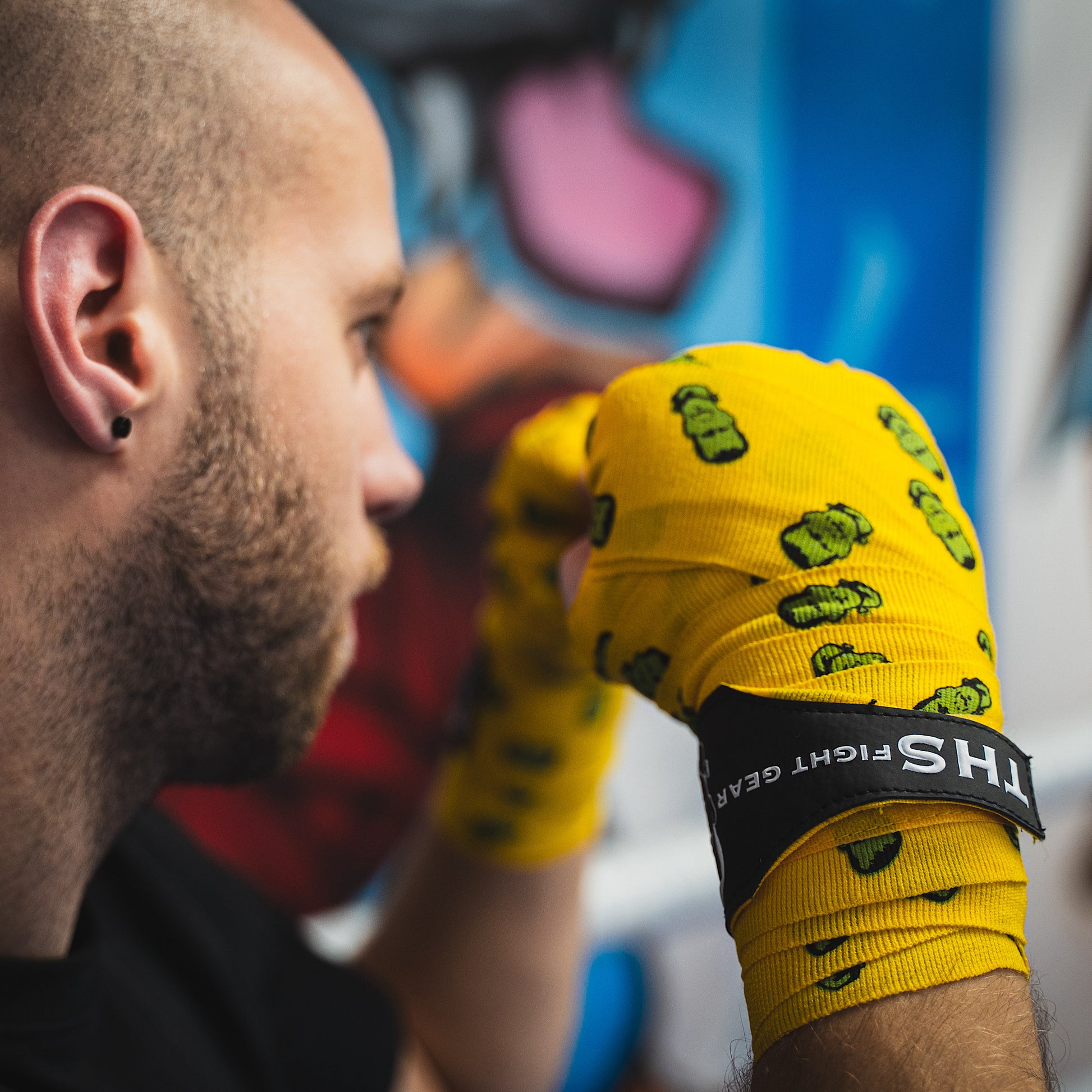 THS Fight Gear yellow with Frankenstein monster hand wraps hands wrapped fighter stance rear view modelled
