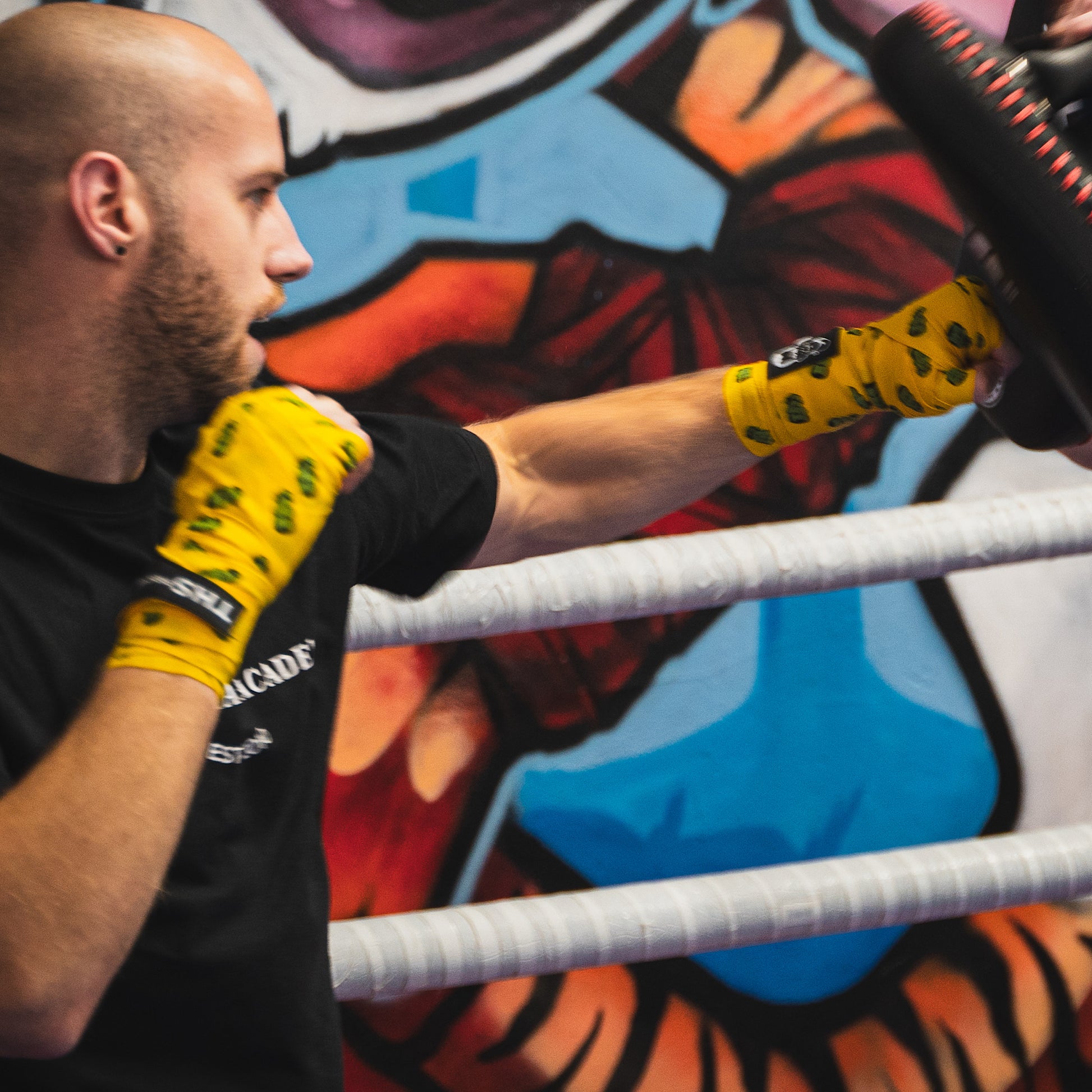 THS Fight Gear yellow with Frankenstein monster hand wraps hands wrapped fighter jab pass right view modelled