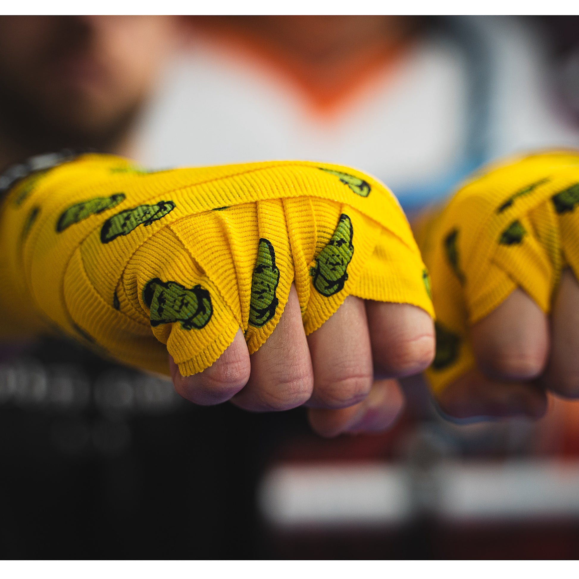 THS Fight Gear yellow with Frankenstein monster hand wraps hands wrapped tight fists front right view modelled