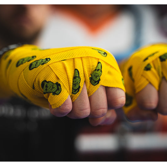 THS Fight Gear yellow with Frankenstein monster hand wraps hands wrapped tight fists front right view modelled