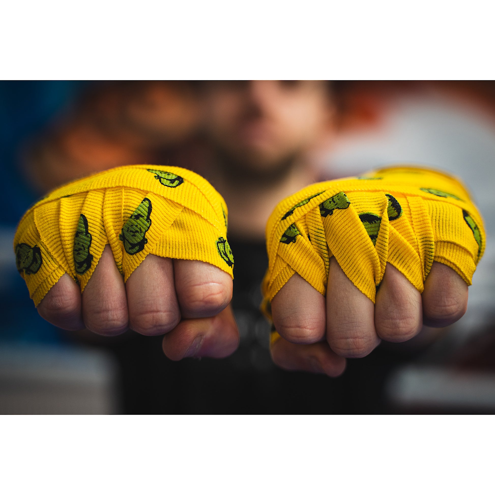 THS Fight Gear yellow with Frankenstein monster hand wraps hands wrapped tight fists front view modelled