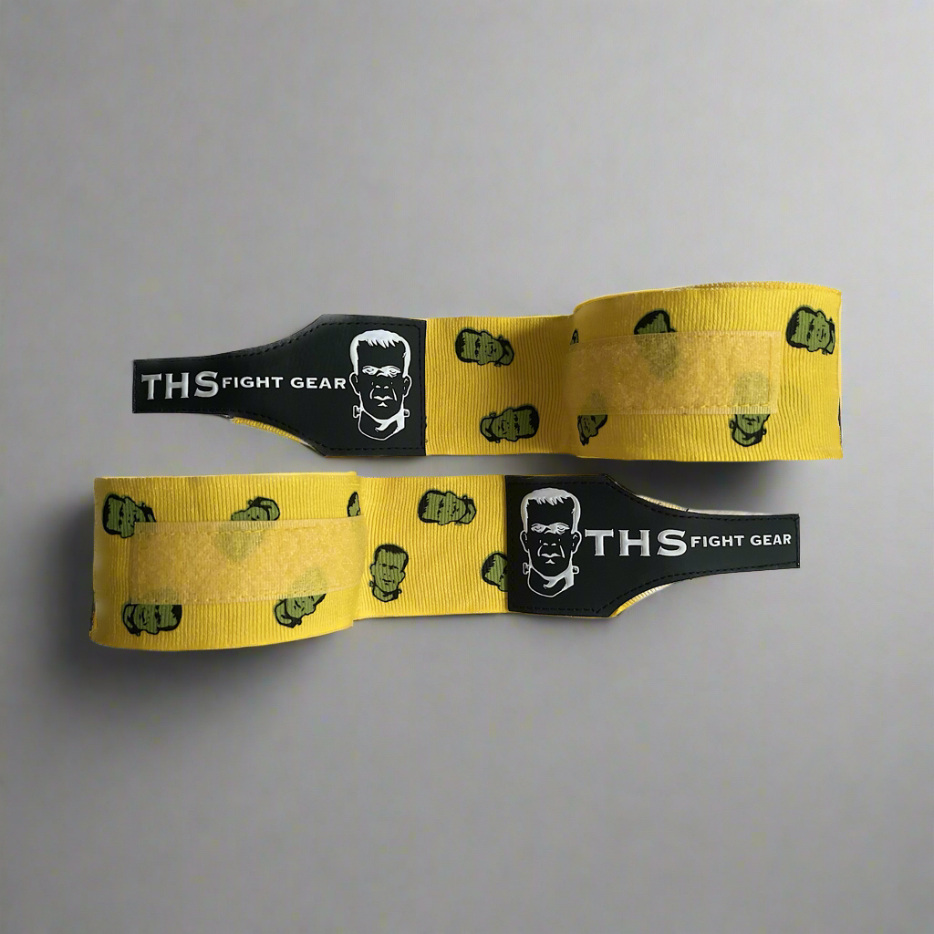 THS Fight Gear yellow with Frankenstein monster hand wraps two wraps half rolled front view display