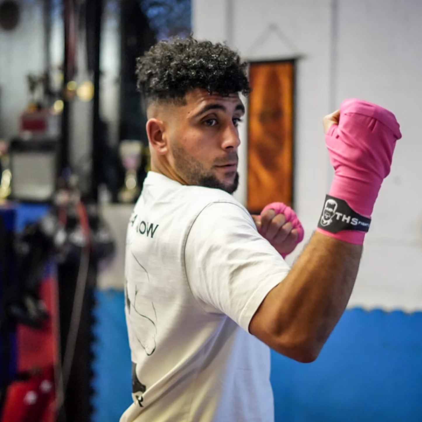 THS Fight Gear pink hand wraps right uppercut modelled front view