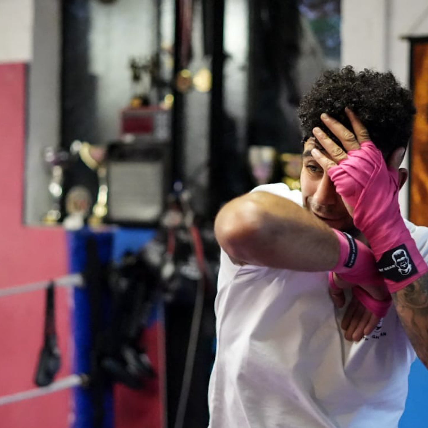 THS Fight Gear pink hand wraps right elbow modelled front view