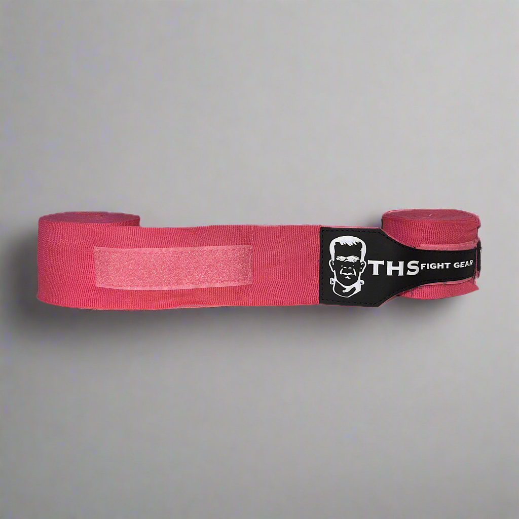 THS Fight Gear pink hand wraps one half rolled front view