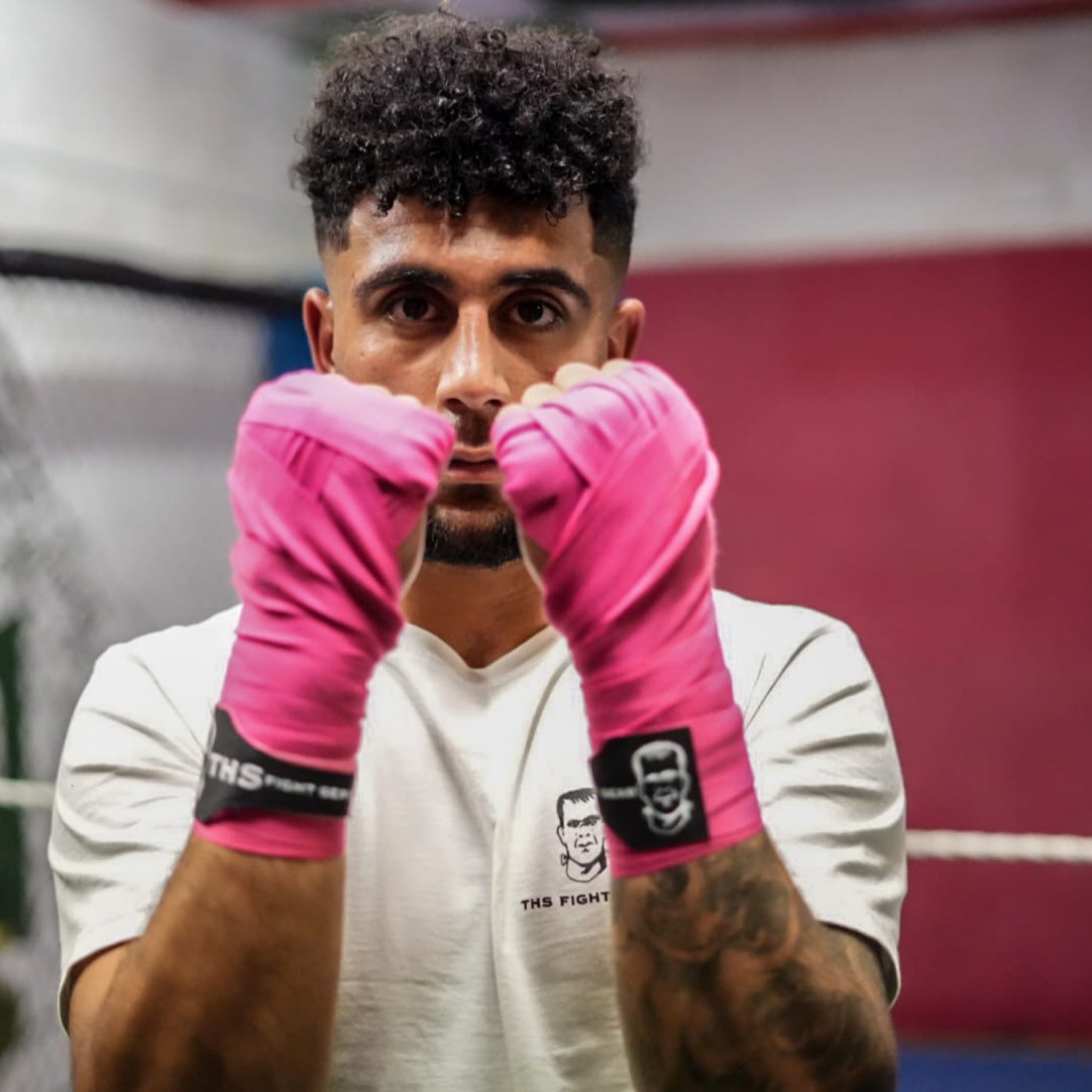 THS Fight Gear pink hand wraps shell guard modelled front view