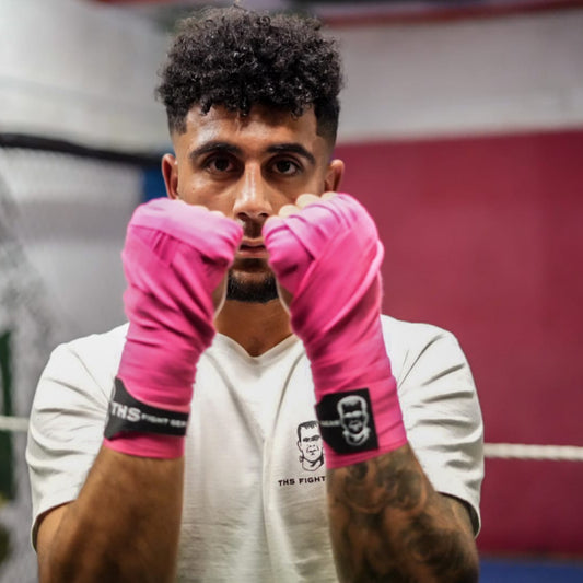 THS Fight Gear pink hand wraps shell guard modelled front view
