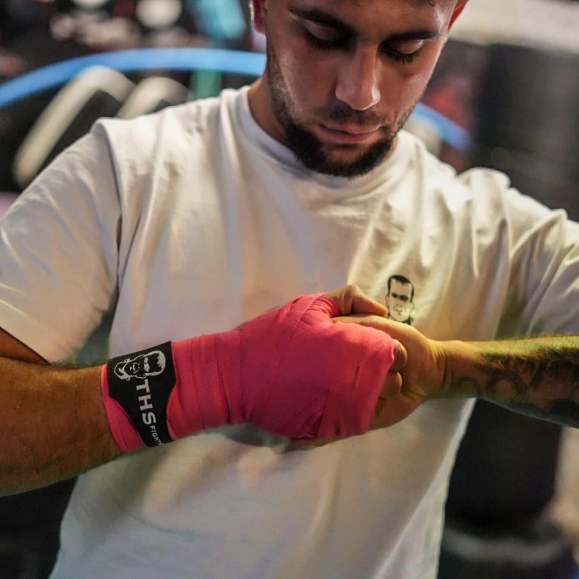 THS Fight Gear pink hand wraps finger grip modelled front view