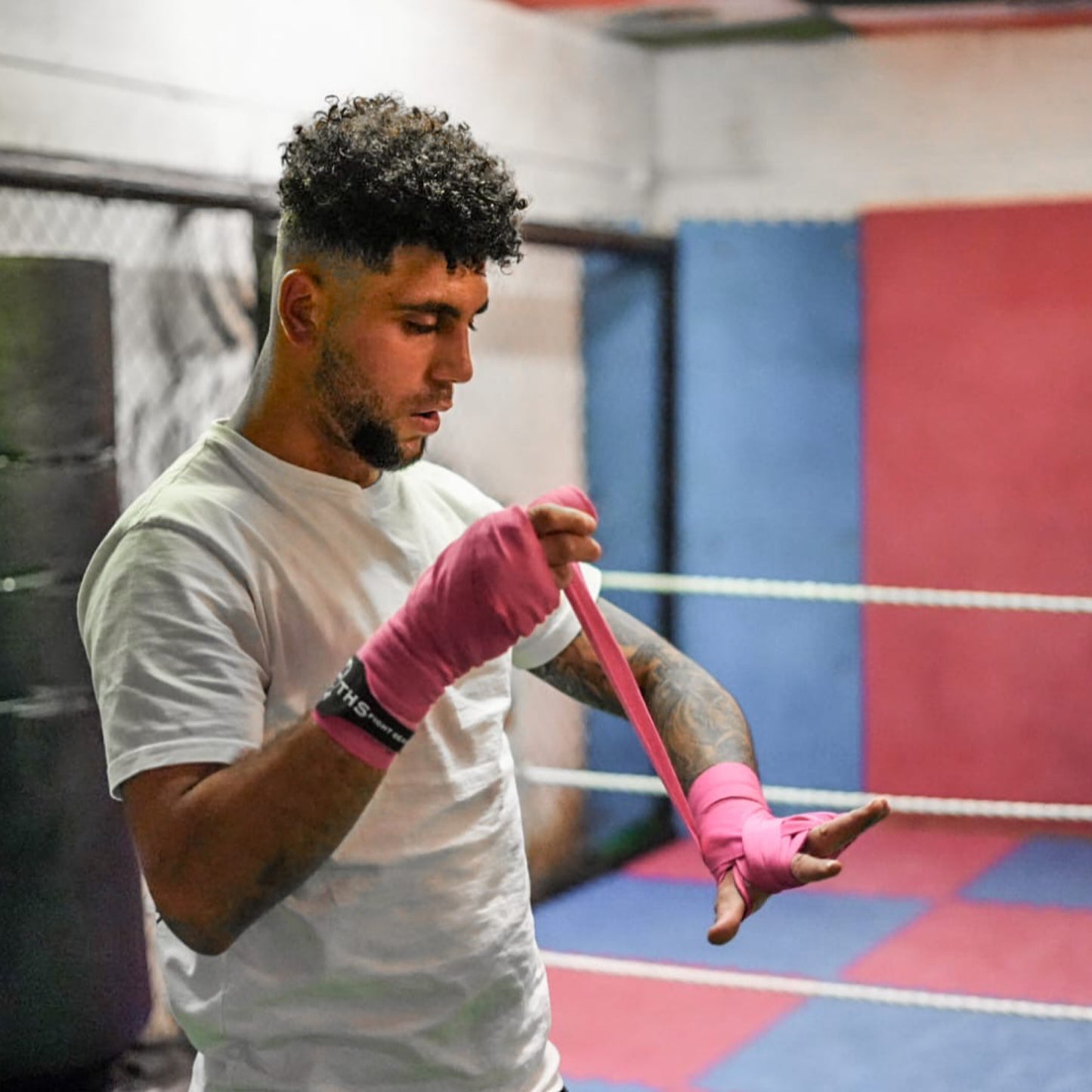 THS Fight Gear pink hand wraps wrapping hands modelled side view