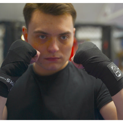 THS Fight Gear black hand wraps hands wrapped fighter stance front view modelled