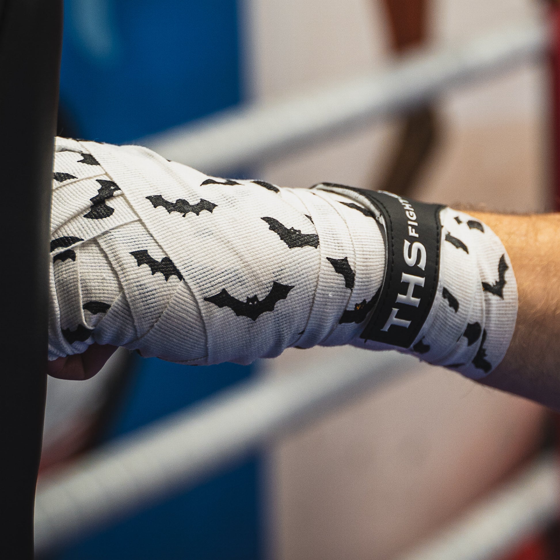 THS Fight Gear white with bats hand wraps wrapped hands jab pads left view modelled