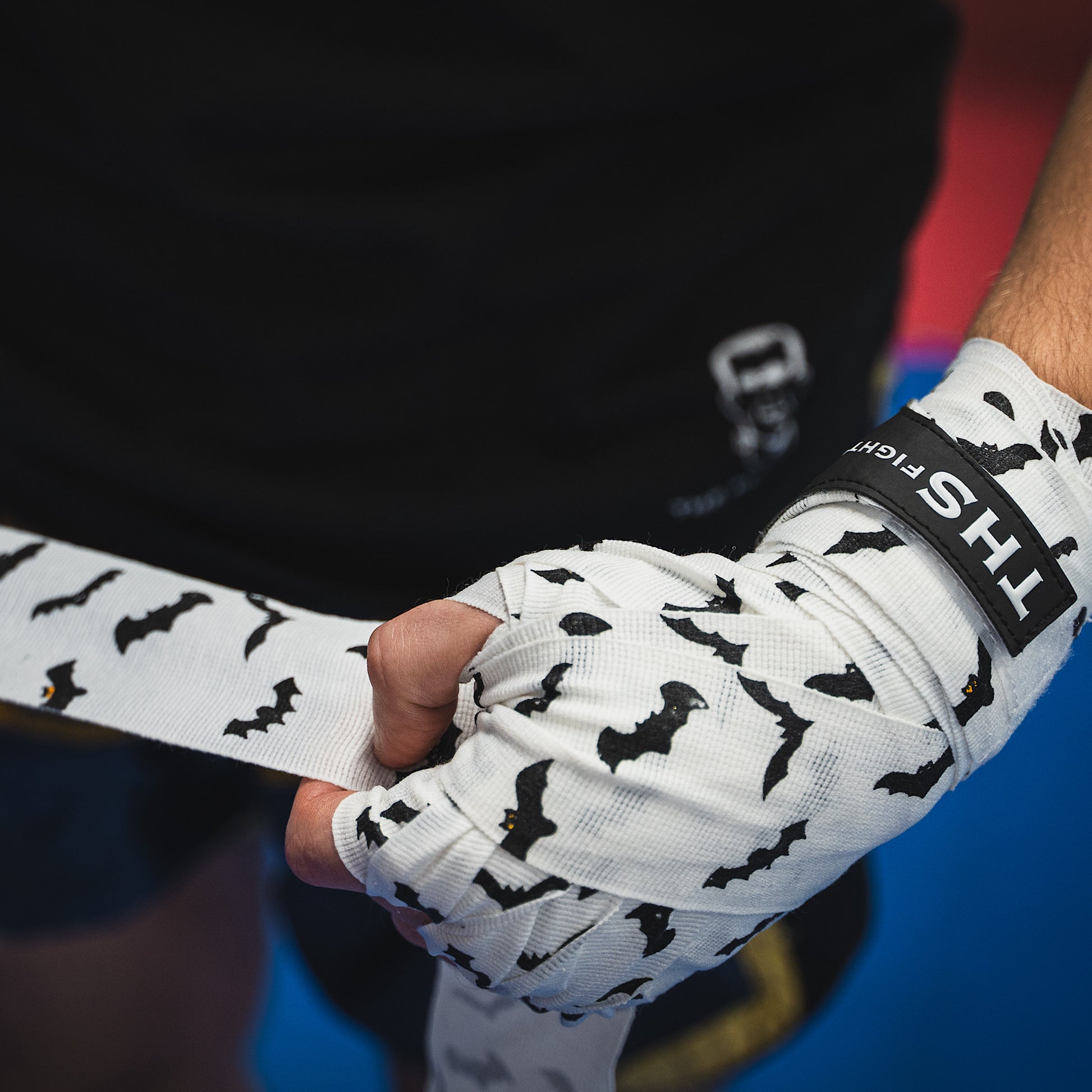 THS Fight Gear white with bats hand wraps wrapping hands front left view modelled